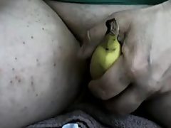 Horny arab girl using a banana up close